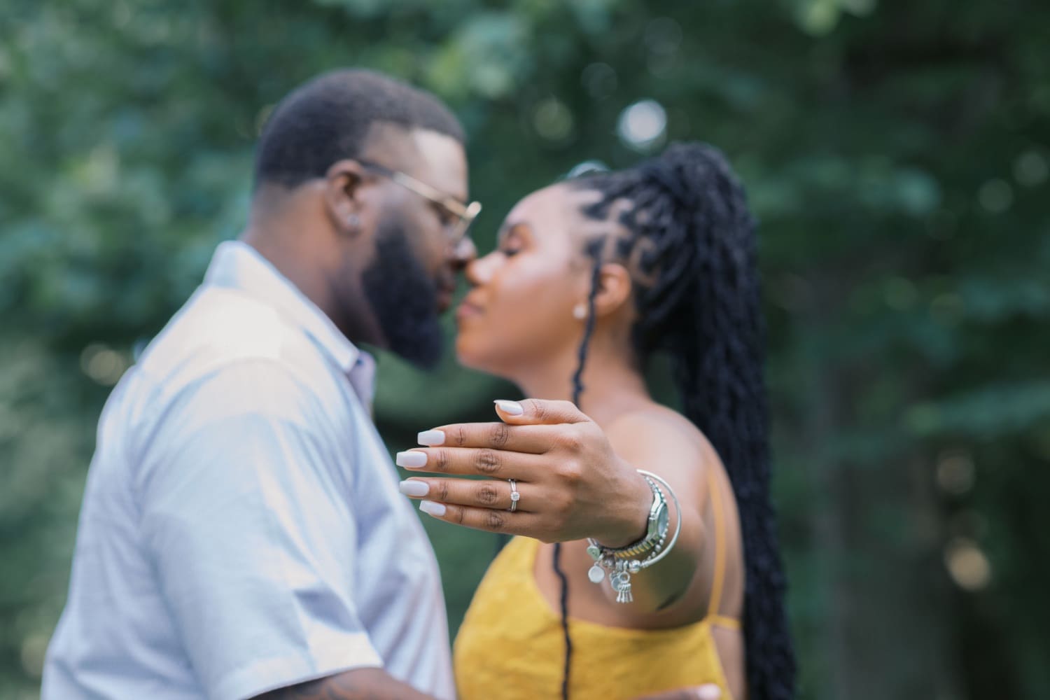 Lovely Boston couple on their engagement shoot. The couple proudly kiss on cam as the bride shows off her engagement ring.
