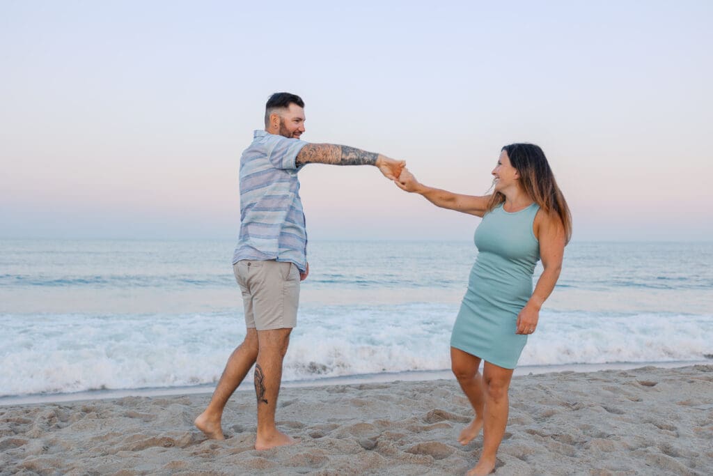 Romantic sunset portrait by the water during golden hour in Boston.