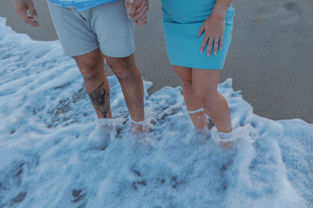 Portrait session by the waterfront during sunset in Boston with warm golden hour light.