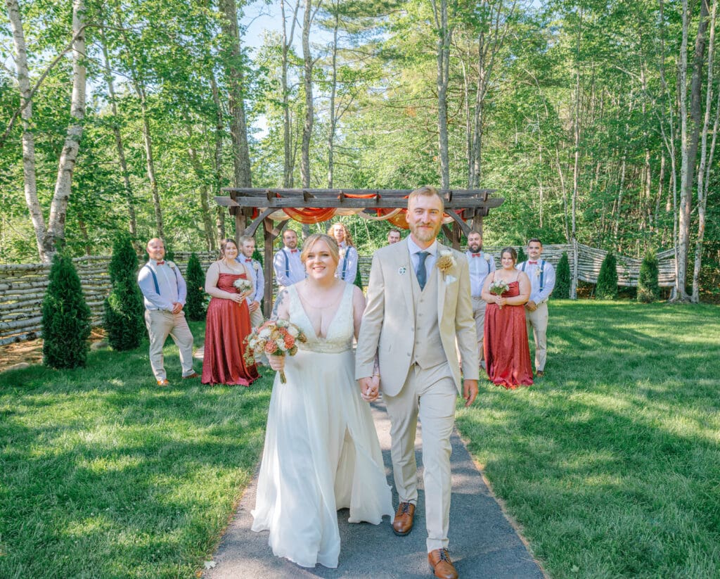 Boston wedding couple walking with wedding party together during wedding