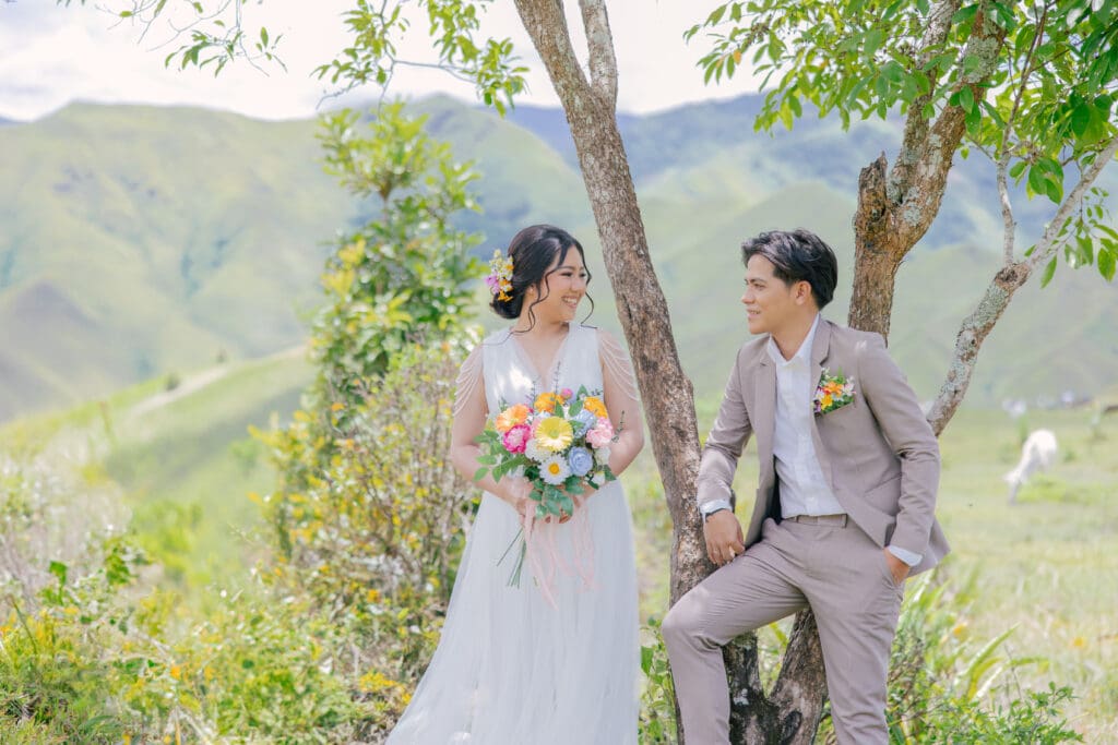 couple learning how to pose naturally in wedding photos during sunset portraits in Boston